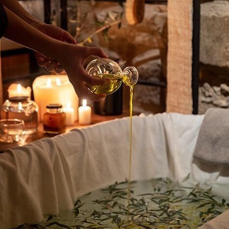 Soothing bath with botanicals and body oils